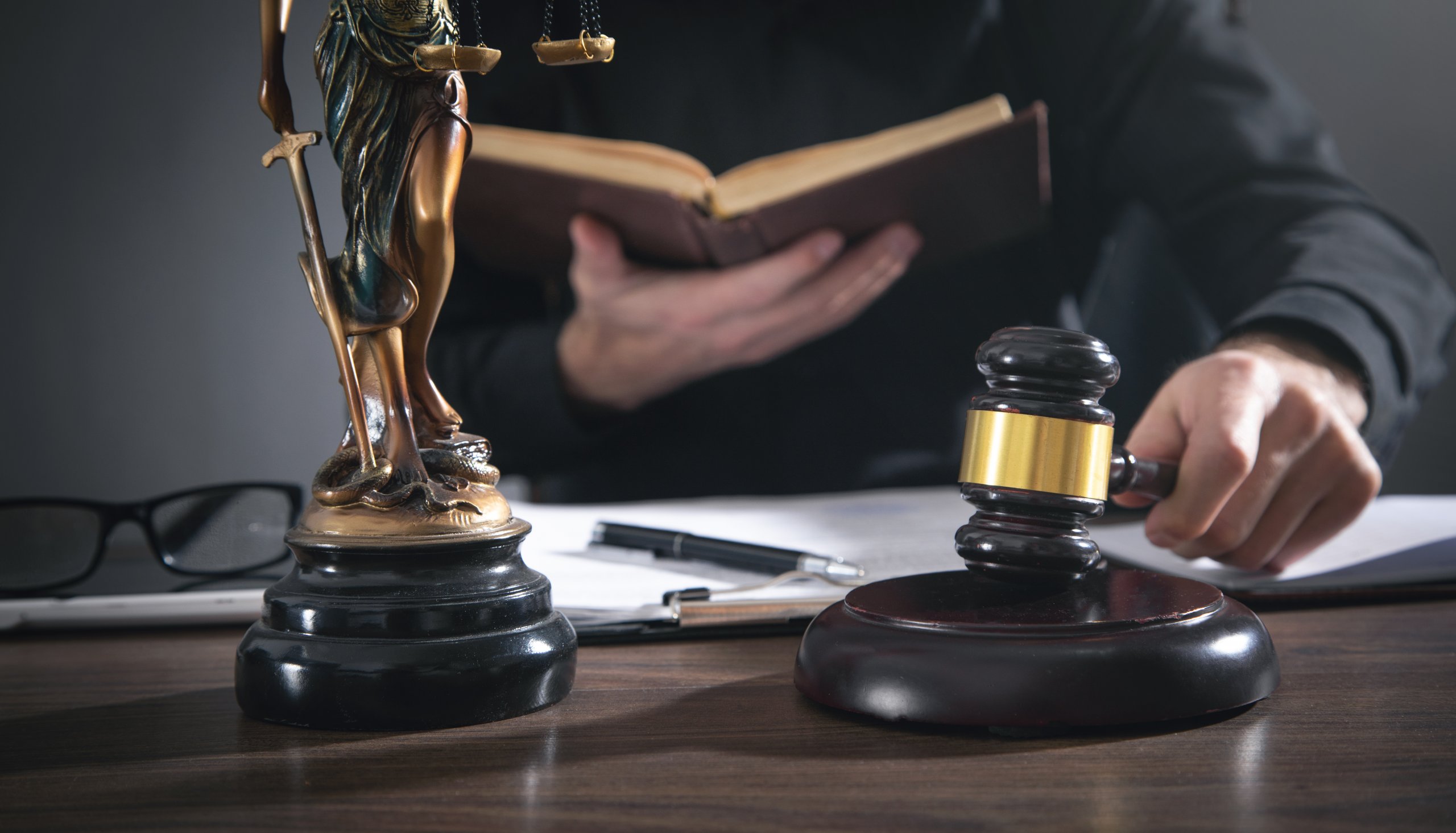 Male judge in a courtroom striking the gavel. - The World's Only ...